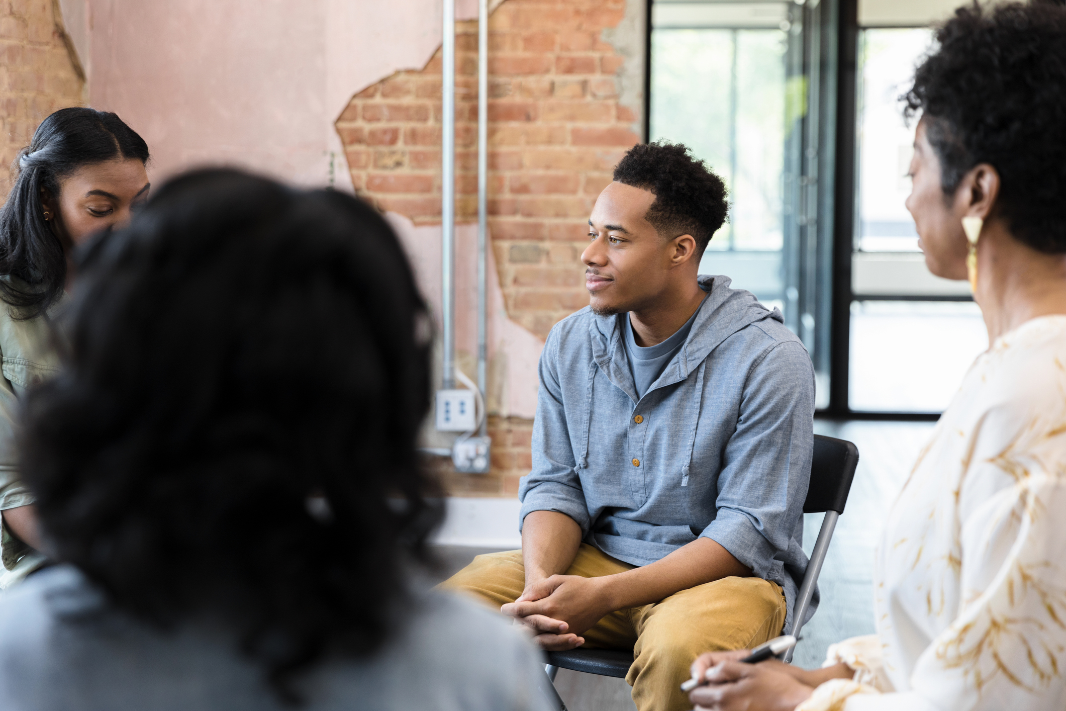 Group of people sitting together having a  meeting