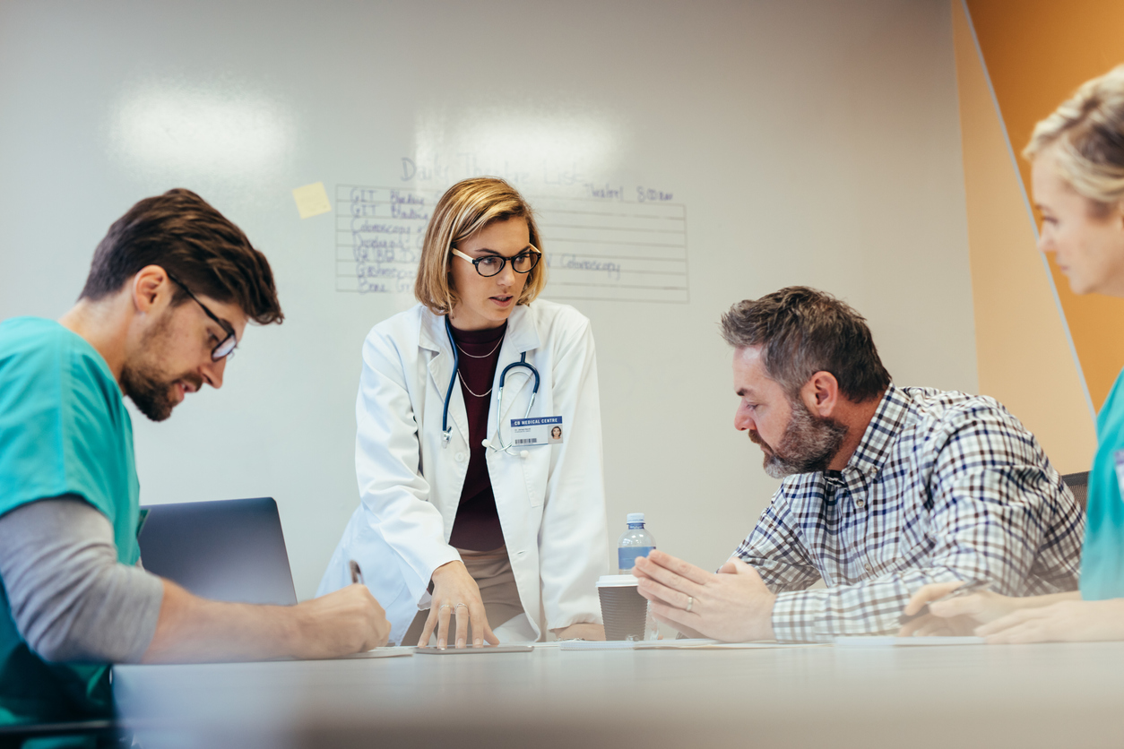 Provider team conversing during a meeting