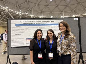 UNC BHWRC members standing in front of a poster at the AcademyHealth Annual Research Conference.