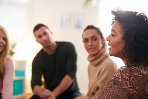 Peer support group leader leading a session